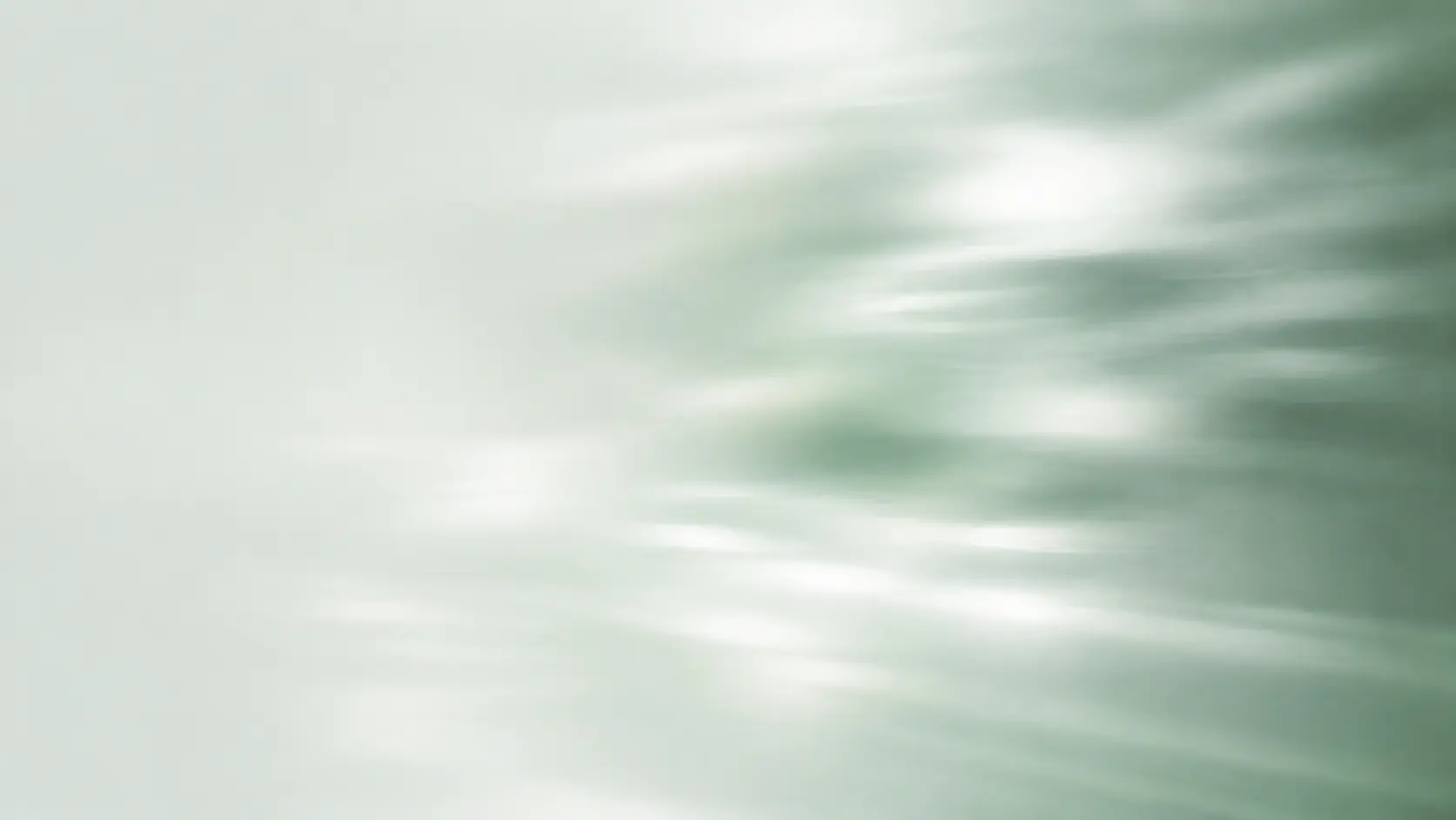 Soft green light moving across frosted glass