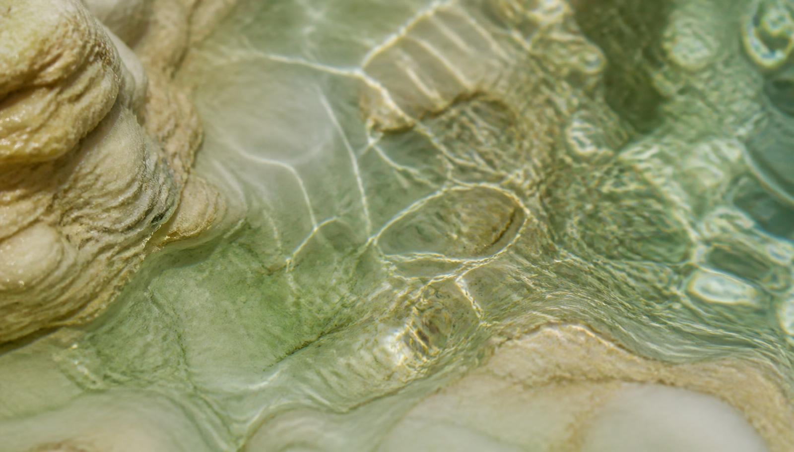 Macro image of water over stone used as a section texture